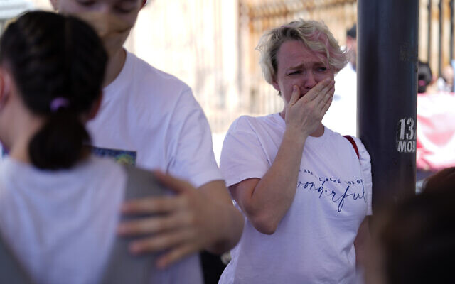 Irina Zolkina, who is seeking asylum in the United States, cries as she recalls her trip from Russia to the Mexican border, standing near the San Ysidro Port of Entry into the United States, in Tijuana, Mexico, Thursday, March 17, 2022. “It’s very hard to understand how they make decisions,” said Zolinka, a 40-year-old Russian woman who camped overnight with her family of seven after arriving in Tijuana on Thursday. (AP Photo/Gregory Bull) Irina Zolkina, who is seeking asylum in the United States, cries as she recalls her trip from Russia to the Mexican border, standing near the San Ysidro Port of Entry into the United States, in Tijuana, Mexico, Thursday, March 17, 2022. “It’s very hard to understand how they make decisions,” said Zolinka, a 40-year-old Russian woman who camped overnight with her family of seven after arriving in Tijuana on Thursday. (AP Photo/Gregory Bull)