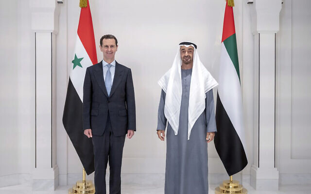 In this photo released by the Emirates News Agency, WAM, Abu Dhabi's Crown Prince, Sheikh Mohammed bin Zayed Al Nahyan, right, and Syrian President Bashar Assad pose for a photo during their meeting in Abu Dhabi, United Arab Emirates, Friday March 18, 2022. Bashar Assad travelled to the United Arab Emirates, marking his first visit to an Arab country since Syria's civil war erupted in 2011, his office said Friday. (Emirates News Agency via AP) In this photo released by the Emirates News Agency, WAM, Abu Dhabi's Crown Prince, Sheikh Mohammed bin Zayed Al Nahyan, right, and Syrian President Bashar Assad pose for a photo during their meeting in Abu Dhabi, United Arab Emirates, Friday March 18, 2022. Bashar Assad travelled to the United Arab Emirates, marking his first visit to an Arab country since Syria's civil war erupted in 2011, his office said Friday. (Emirates News Agency via AP)