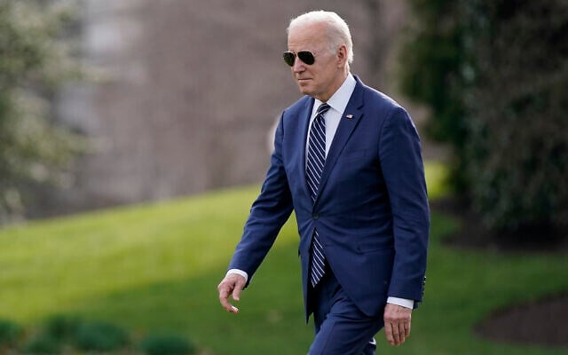 President Joe Biden walks on the South Lawn of the White House before boarding Marine One, March 18, 2022, in Washington. Biden is spending the weekend at his home in Rehoboth Beach, Del. (AP Photo/Patrick Semansky)
