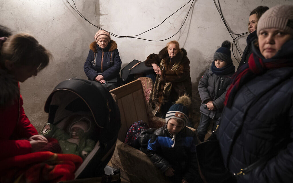 People hide in a shelter during Russian shelling, in Mariupol, Ukraine, Feb. 24, 2022. (Mstyslav Chernov/AP)