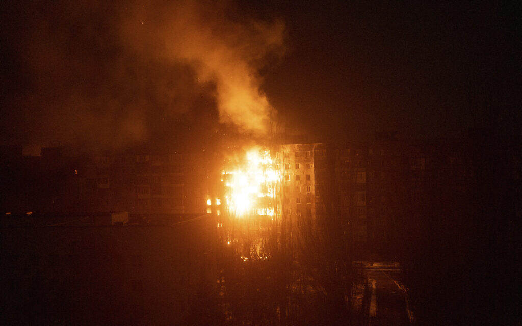 A fire burns at an apartment building after it was hit by shelling in Mariupol, Ukraine, March 11, 2022. (Mstyslav Chernov/AP)