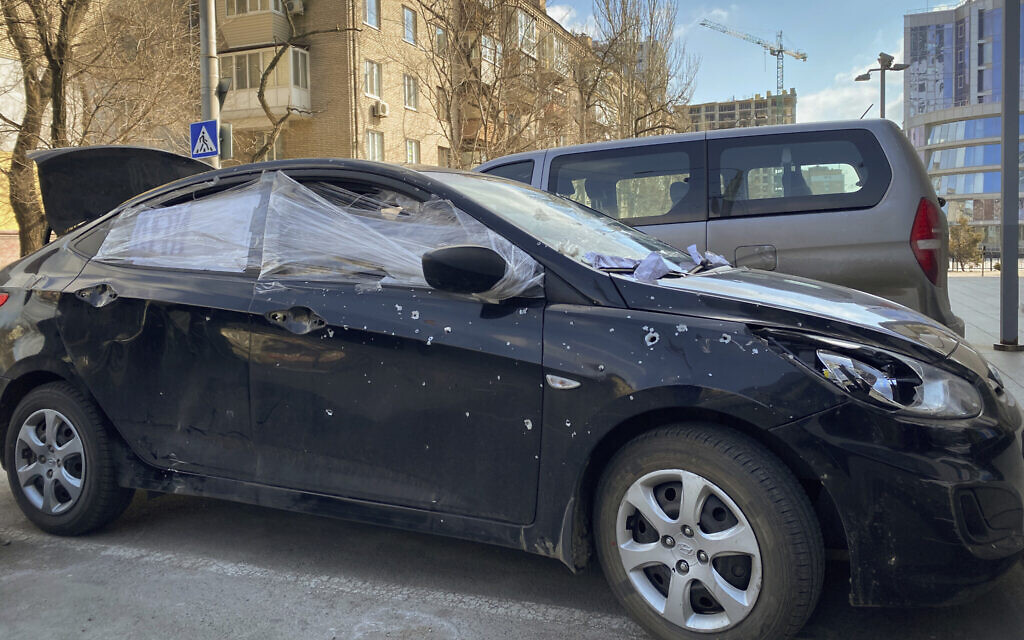 A car damaged by shelling that was used by Associated Press journalists to escape from the Mariupol blockade sits parked in Ukraine, March 17, 2022. (Mstyslav Chernov/AP)