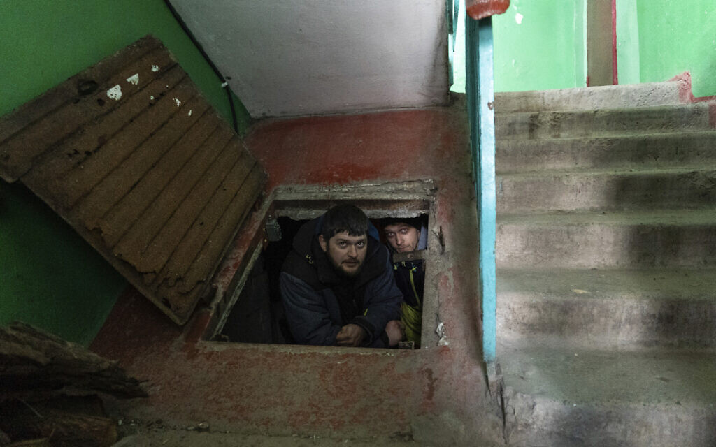 People hide in an improvised bomb shelter in Mariupol, Ukraine, March 12, 2022. (Mstyslav Chernov/AP)