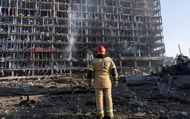 A firefighter looks at the destruction caused after shelling of a shopping center, in Kyiv, Ukraine, March 21, 2022. (AP Photo/Rodrigo Abd) A firefighter looks at the destruction caused after shelling of a shopping center, in Kyiv, Ukraine, March 21, 2022. (AP Photo/Rodrigo Abd)