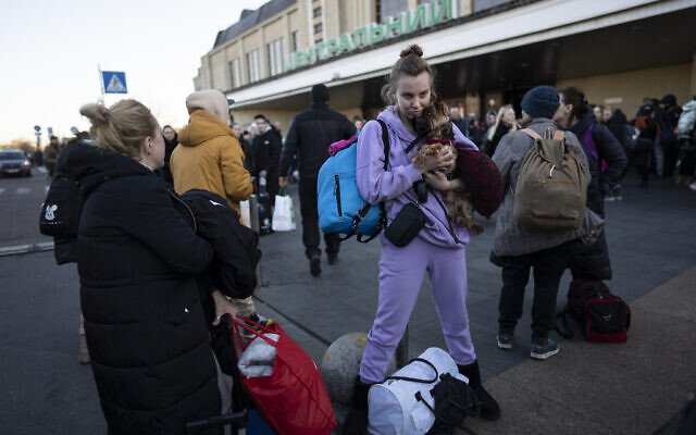 Daryna Kovalenko, 19 , holds her dog Tim, while arriving at Kyiv's train station after leaving her home in Chernihiv, Ukraine, through a humanitarian corridor, Monday, March 21, 2022. (AP/Rodrigo Abd) Daryna Kovalenko, 19 , holds her dog Tim, while arriving at Kyiv's train station after leaving her home in Chernihiv, Ukraine, through a humanitarian corridor, Monday, March 21, 2022. (AP/Rodrigo Abd)