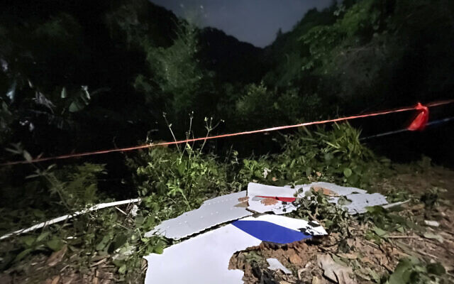 In this photo released by China's Xinhua News Agency, debris is seen at the site of a plane crash in Tengxian County in southern China's Guangxi Zhuang Autonomous Region, March 22, 2022. (Zhou Hua/Xinhua via AP) In this photo released by China's Xinhua News Agency, debris is seen at the site of a plane crash in Tengxian County in southern China's Guangxi Zhuang Autonomous Region, March 22, 2022. (Zhou Hua/Xinhua via AP)