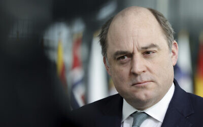 British Defense Minister Ben Wallace speaks with the media as he arrives for a meeting of NATO defense ministers at NATO headquarters in Brussels, March 16, 2022. (Olivier Matthy/AP)