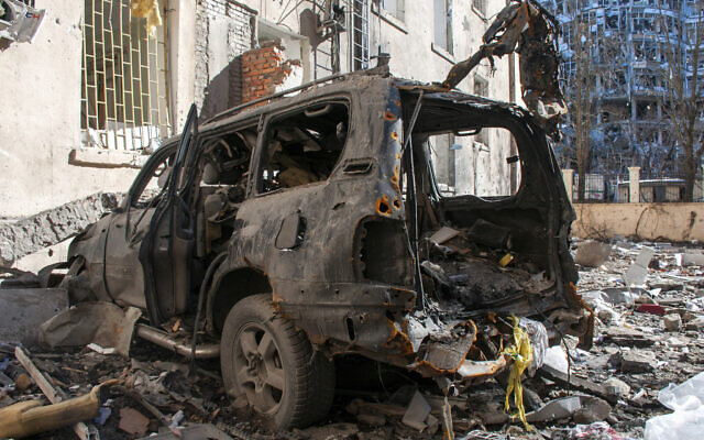 A car destroyed by shelling is seen in a street in Kharkiv, Ukraine, March 22, 2022. (Andrew Marienko/AP) A car destroyed by shelling is seen in a street in Kharkiv, Ukraine, March 22, 2022. (Andrew Marienko/AP)