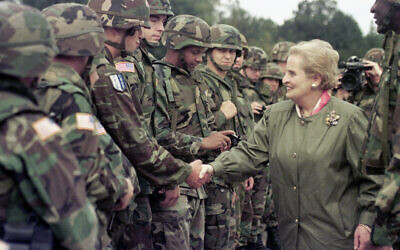 US Secretary of State Madeleine Albright shakes hands with US soldiers during her visit to Air Base Eagle near Tuzla, Bosnia Aug, 30, 1998.  Albright has died of cancer, her family said Wednesday, March 23, 2022.(AP Photo/Amel Emric, File)