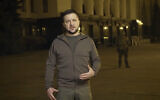In this image from video provided by the Ukrainian Presidential Press Office, Ukrainian President Volodymyr Zelensky speaks from Kyiv, Ukraine, early Thursday, March 24, 2022. (Ukrainian Presidential Press Office via AP)