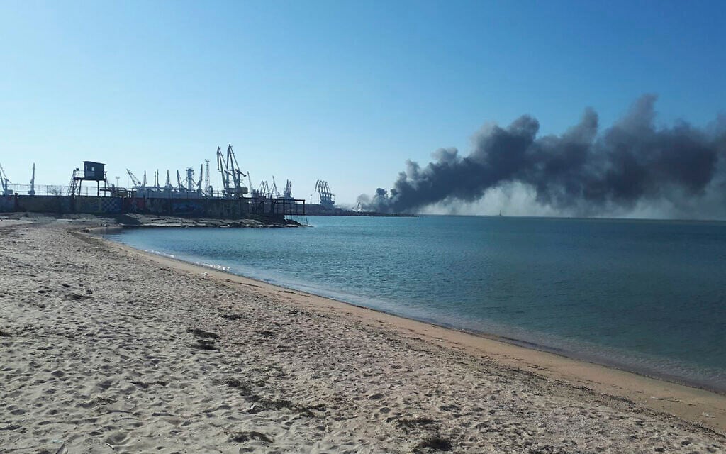 Smoke rises after shelling near a seaport in Berdyansk, Ukraine, March 24, 2022. (AP Photo)