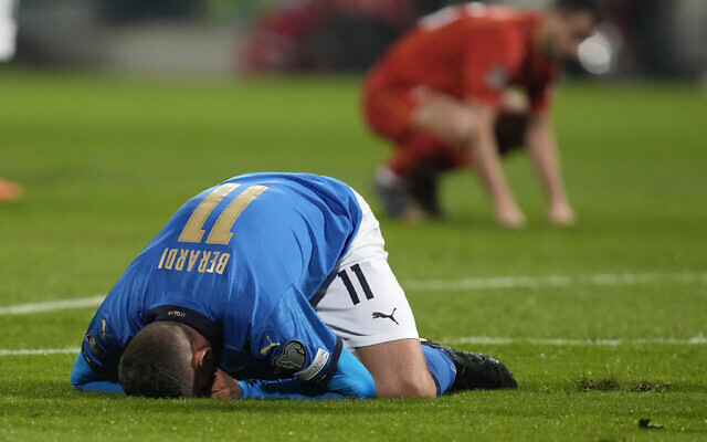 Italy's Domenico Berardi on his knees after missing a scoring chance during the World Cup qualifying play-off soccer match between Italy and North Macedonia, at Renzo Barbera stadium, in Palermo, Italy, Thursday, March 24, 2022. (AP Photo/Antonio Calanni) Italy's Domenico Berardi on his knees after missing a scoring chance during the World Cup qualifying play-off soccer match between Italy and North Macedonia, at Renzo Barbera stadium, in Palermo, Italy, Thursday, March 24, 2022. (AP Photo/Antonio Calanni)
