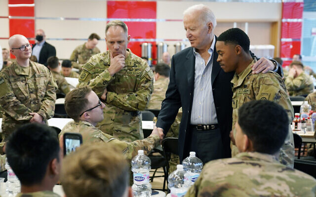 President Joe Biden visits with members of the 82nd Airborne Division at the G2A Arena, Friday, March 25, 2022, in Jasionka, Poland. (AP Photo/Evan Vucci)