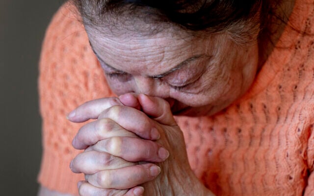 Ukrainian Holocaust survivor Tatyana Zhuravliova reacts during an AP interview in an old people's home in Frankfurt, Germany, March 27, 2022. (AP Photo/Michael Probst)