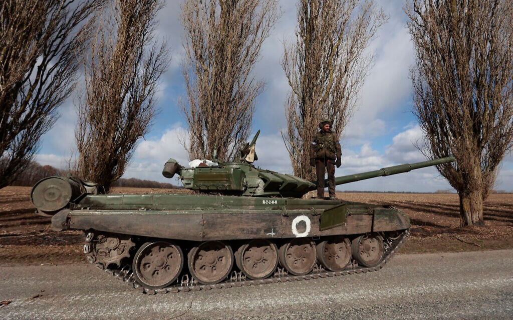 A Ukrainian serviceman stands on a tank in the village of Lukyanivka, Kyiv region, Ukraine, March 27, 2022. (AP Photo)