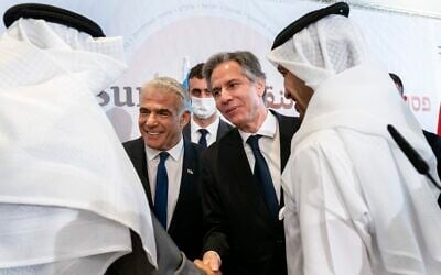 After meeting for the Negev Summit, Israel's Foreign Minister Yair Lapid, center left, and US Secretary of State Antony Blinken, shake hands with Bahrain's Foreign Minister Abdullatif bin Rashid al-Zayani, front left, and United Arab Emirates' Foreign Minister Sheikh Abdullah bin Zayed Al Nahyan, front right, March 28, 2022, in Sde Boker, Israel. (AP Photo/Jacquelyn Martin, Pool)