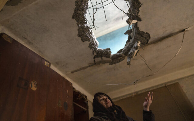 Halyna Falko, 52, talks to reporters while looking at the destruction caused after a Russian attack inside her house near Brovary, on the outskirts of Kyiv, Ukraine, March 28, 2022. (AP Photo/Rodrigo Abd) Halyna Falko, 52, talks to reporters while looking at the destruction caused after a Russian attack inside her house near Brovary, on the outskirts of Kyiv, Ukraine, March 28, 2022. (AP Photo/Rodrigo Abd)