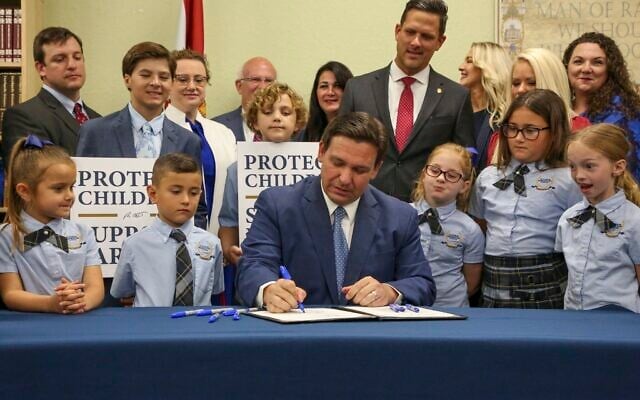 Florida Gov. Ron DeSantis signs the Parental Rights in Education bill at Classical Preparatory school on March 28, 2022, in Shady Hills, Florida. (Douglas R. Clifford/Tampa Bay Times via AP) Florida Gov. Ron DeSantis signs the Parental Rights in Education bill at Classical Preparatory school on March 28, 2022, in Shady Hills, Florida. (Douglas R. Clifford/Tampa Bay Times via AP)