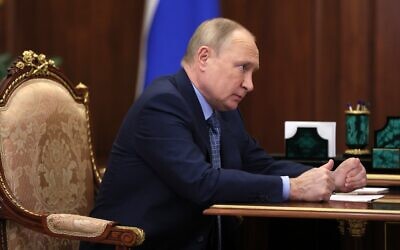 Russian President Vladimir Putin listens to Mahmud-Ali Kalimatov, the head of the Republic of Ingushetia during their meeting in Moscow, Russia, March 30, 2022. (Mikhail Klimentyev, Sputnik, Kremlin Pool Photo via AP)