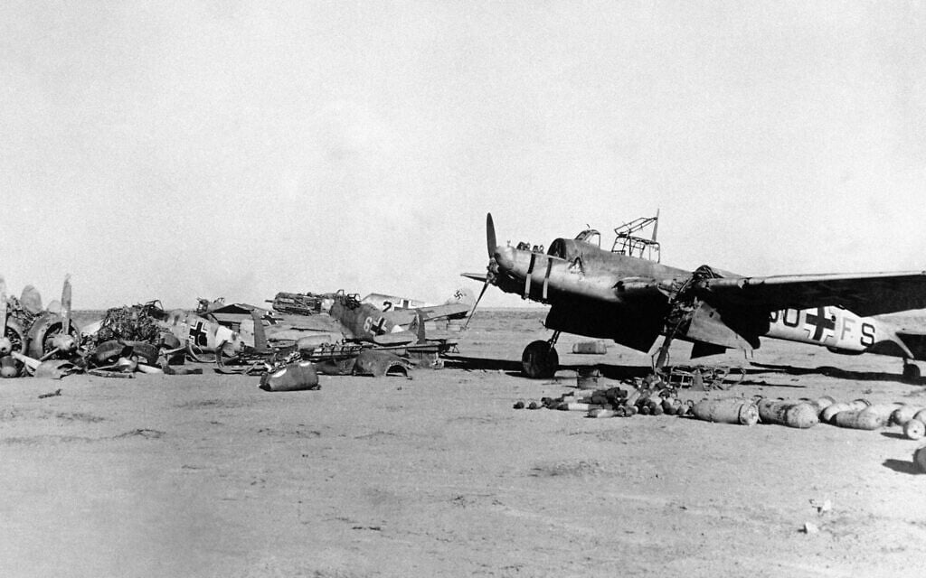 Jumbled wreckage of Axis aircraft on an advanced landing ground, in Libya, on February 14, 1942. (AP Photo)