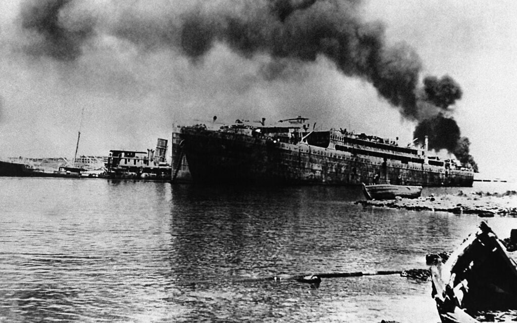 The remains of a British troop transport in the harbour of Tobruk on August 3, 1942, after an attack by German Stuka bombers. (AP Photo)