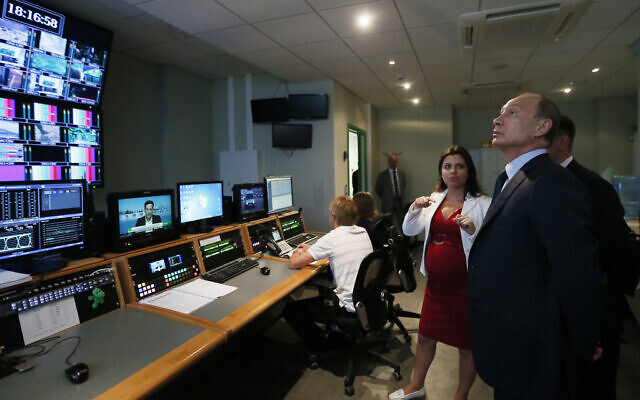 In this June 11, 2013 file photo, Russian President Vladimir Putin, right, visits the new headquarters of the 'Russia Today' television channel in Moscow, Russia. (Yuri Kochetkov/Pool Photo via AP, File) In this June 11, 2013 file photo, Russian President Vladimir Putin, right, visits the new headquarters of the 'Russia Today' television channel in Moscow, Russia. (Yuri Kochetkov/Pool Photo via AP, File)