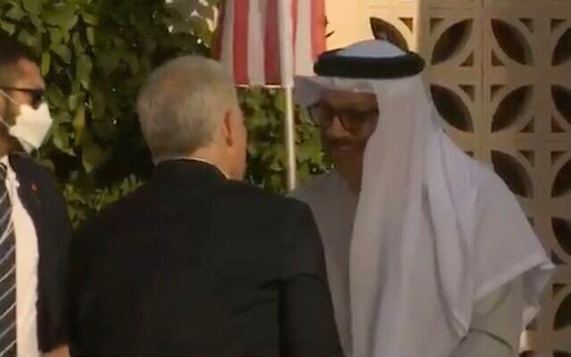 Foreign Minister Yair Lapid greets his Bahrain counterpart Abdullatif bin Rashid Al-Zayani at the Kedma hotel in Sde Boker on March 27, 2022, ahead of the Negev Summit. (Screen capture: Channel 12) Foreign Minister Yair Lapid greets his Bahrain counterpart Abdullatif bin Rashid Al-Zayani at the Kedma hotel in Sde Boker on March 27, 2022, ahead of the Negev Summit. (Screen capture: Channel 12)