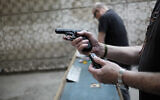 Illustrative: Israelis practice shooting handguns at the Olympic Shooting Range in Hertzliya, October 18, 2015. (Tomer Neuberg/Flash90/File)