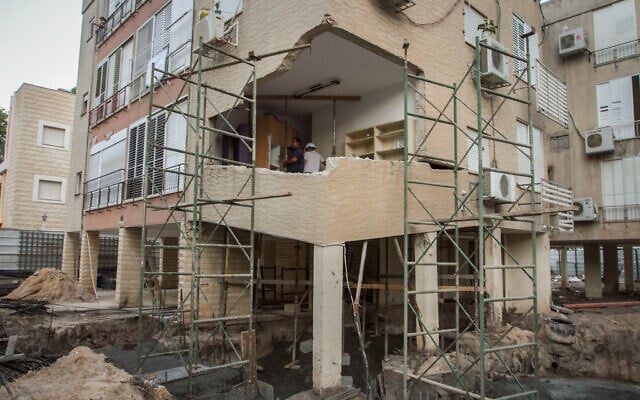 Illustrative: A building in Kiryat Bialik undergoing urban renewal as part of Tama 38 regulation, on October 24, 2018. (Meir Vaaknin/Flash90) Illustrative: A building in Kiryat Bialik undergoing urban renewal as part of Tama 38 regulation, on October 24, 2018. (Meir Vaaknin/Flash90)