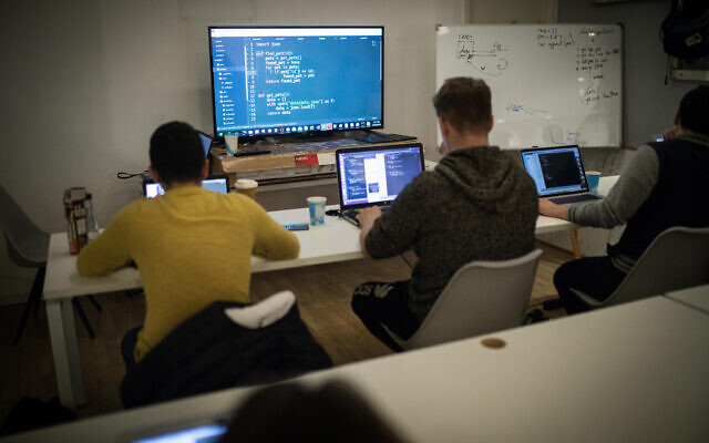 Illustrative: French Orthodox Jewish students study during a class on coding, at the Developers Institute Coding Bootcamp, in Tel Aviv on February 21, 2019. (Hadas Parush/Flash90) Illustrative: French Orthodox Jewish students study during a class on coding, at the Developers Institute Coding Bootcamp, in Tel Aviv on February 21, 2019. (Hadas Parush/Flash90)