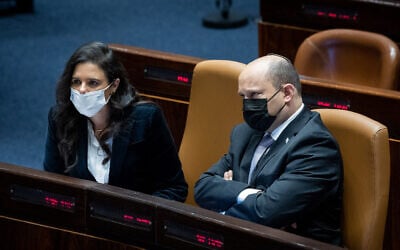 Prime Minister Naftali Bennett (right) with Interior Minister Ayelet Shaked during a plenum session at the Knesset, the Israeli parliament in Jerusalem, February 28, 2022. (Yonatan Sindel/Flash90) Prime Minister Naftali Bennett (right) with Interior Minister Ayelet Shaked during a plenum session at the Knesset, the Israeli parliament in Jerusalem, February 28, 2022. (Yonatan Sindel/Flash90)