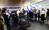 Israeli and Ukrainian refugees arrive from Ukraine on a rescue flight that landed at Ben Gurion International Airport near Tel Aviv on March 3, 2022. (Avshalom Sassoni/Flash90)