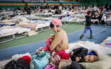 Ukrainian refugees at an emergency shelter in Chisinau, Moldova, March 5, 2022. (Nati Shohat/Flash90)