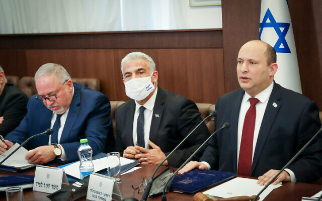 Prime Minister Naftali Bennett (right) leads a cabinet meeting at the Prime Minister's Office in Jerusalem on March 6, 2022, hours after flying to Russia and Germany in an effort to mediate a resolution to Russia's invasion of Ukraine. (Marc Israel Sellem/POOL/Flash90) Prime Minister Naftali Bennett (right) leads a cabinet meeting at the Prime Minister's Office in Jerusalem on March 6, 2022, hours after flying to Russia and Germany in an effort to mediate a resolution to Russia's invasion of Ukraine. (Marc Israel Sellem/POOL/Flash90)