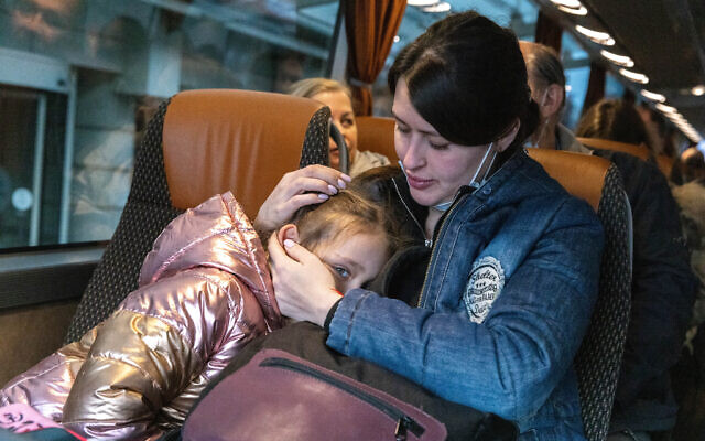 Jewish Ukrainians who fled fighting in Ukraine depart a hotel in Warsaw to board a plane to Israel, March 6, 2022. (Olivier Fitoussi/Flash90)