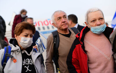 Jewish immigrants fleeing the war in Ukraine, on a rescue flight sponsored by the IFCJ, arrive at Ben Gurion airport near Tel Aviv on March 6, 2022. (Tomer Neuberg/FLASH90)