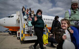 Ukrainians who fled the fighting in Ukraine land at Ben Gurion Airport outside Tel Aviv on March 17, 2022. (Yossi Zeliger/Flash90)