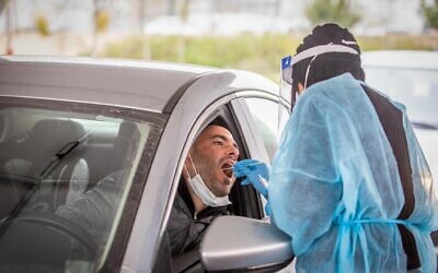 A man is tested in Modiin, March 21, 2022 (Yossi Aloni/Flash90)