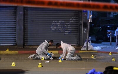 Members of the Zaka voluntary organization are seen at the scene of an attack in Hadera, March 27, 2022 (Gili Yaari/Flash90) Members of the Zaka voluntary organization are seen at the scene of an attack in Hadera, March 27, 2022 (Gili Yaari/Flash90)