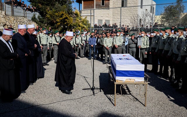 Mourners attend the funeral of Border Police officer Yezen Falah, who was killed in the terror attack in Hadera, at the cemetery in the village of Kisra-Sumei, March 28, 2022. (David Cohen/Flash90) Mourners attend the funeral of Border Police officer Yezen Falah, who was killed in the terror attack in Hadera, at the cemetery in the village of Kisra-Sumei, March 28, 2022. (David Cohen/Flash90)