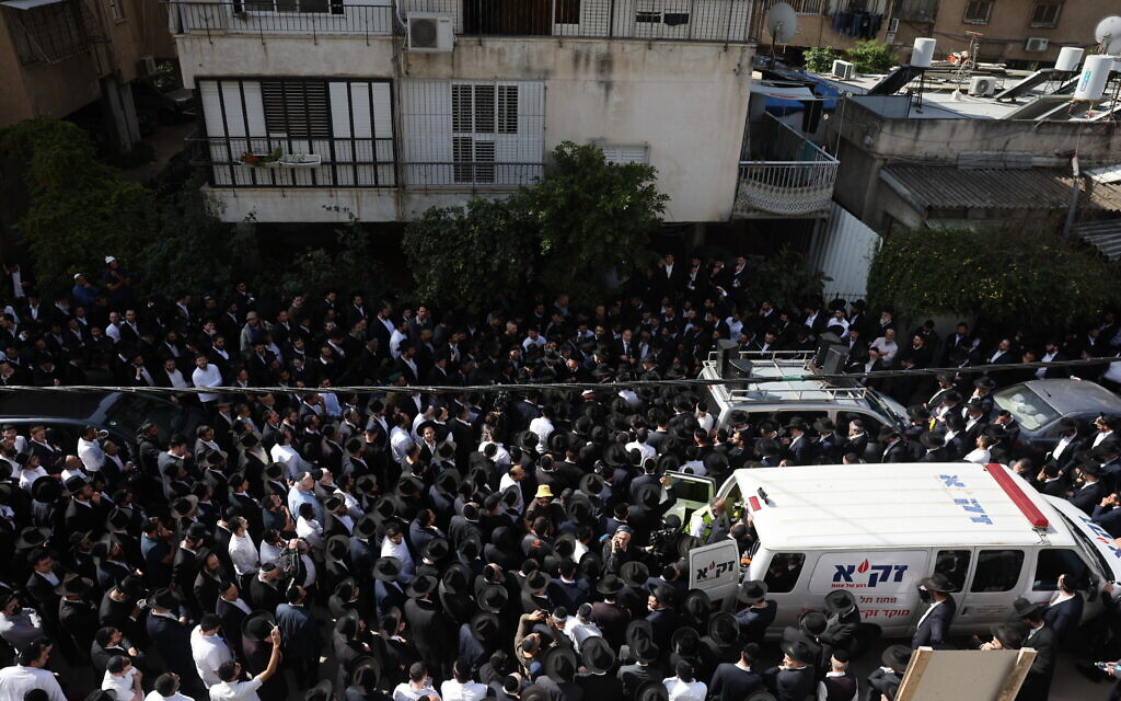 Mourners at the funeral of Avishai Yehezkel  who was killed in a terror attack in Bnei Brak, March 30, 2022 (Yonatan Sindel/Flash90)