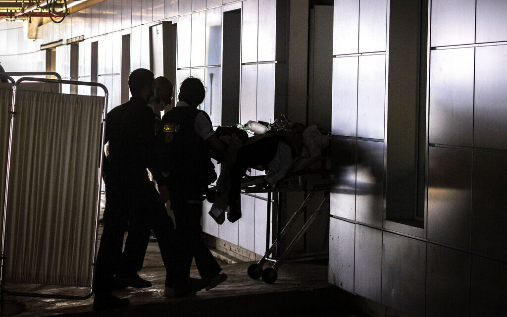 A man who was stabbed and seriously hurt in a terror attack in the West Bank is brought to the Shaare Zedek Medical Center in Jerusalem, March 31, 2022. (Olivier Fitoussi/FLASH9)