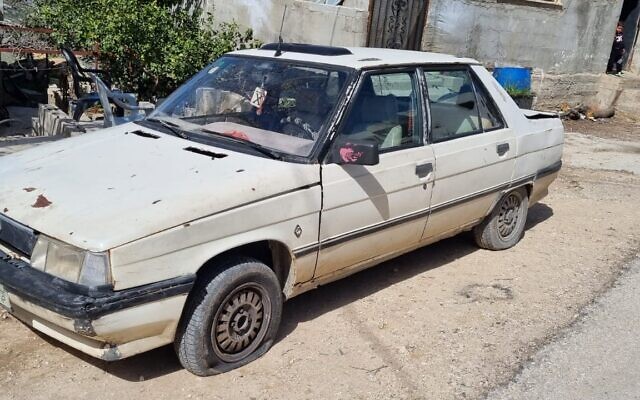 A Palestinian car with its tires slashed in the West Bank village of Iskaka, March 2, 2022. (Yesh Din) A Palestinian car with its tires slashed in the West Bank village of Iskaka, March 2, 2022. (Yesh Din)
