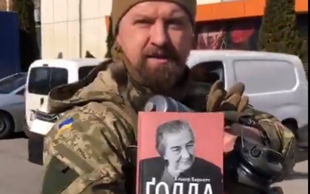 A Ukrainian officer shows off a biography of Golda Meir that he carries into battle with him. (Screen capture: Twitter) A Ukrainian officer shows off a biography of Golda Meir that he carries into battle with him. (Screen capture: Twitter)