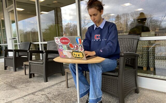 Fashion model and Cornell University computer science student Lior Cole at work on her laptop. (Courtesy of Lior Cole)