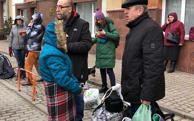Israelis and their relatives wait for a 'rescue bus' that will ferry them from Lviv across Poland's border with Ukraine, leaving behind the war-stricken country, on March 2, 2022. (Lazar Berman/The Times of Israel) Israelis and their relatives wait for a 'rescue bus' that will ferry them from Lviv across Poland's border with Ukraine, leaving behind the war-stricken country, on March 2, 2022. (Lazar Berman/The Times of Israel)