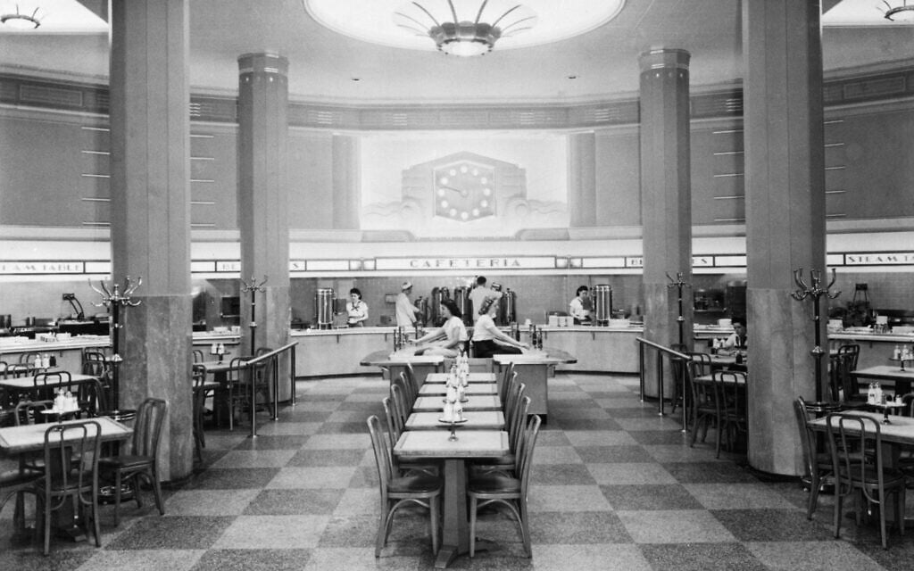 Interior view of an Automat restuarant showing a general view of the serving area and cashiers c. 1950 in The Automat cafeteria. (A Slice of Pie Productions)