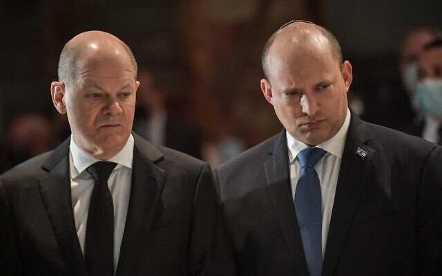 German Chancellor Olaf Scholz (L) visits the Yad Vashem Holocaust Memorial, with Prime Minister Naftali Bennett (R), on March 2, 2022. (Kobi Gideon / GPO) German Chancellor Olaf Scholz (L) visits the Yad Vashem Holocaust Memorial, with Prime Minister Naftali Bennett (R), on March 2, 2022. (Kobi Gideon / GPO)