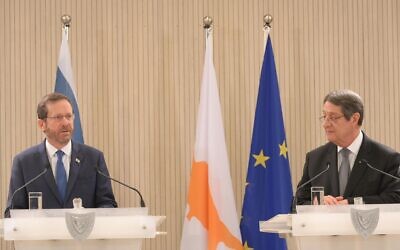President Isaac Herzog, left, with Cypriot President Nicos Anastasiades at the Presidential Palace in Nicosia, Cyprus, March 2, 2022. (Amos Ben-Gershom/GPO)