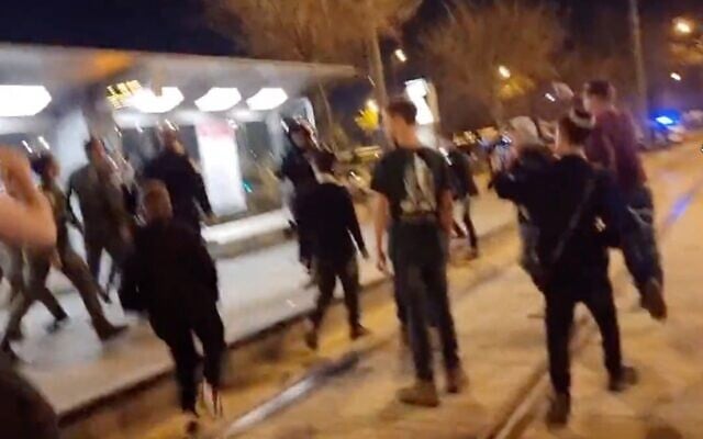 A mob of dozens of young Jewish teens is filmed roaming the streets of downtown Jerusalem, chanting 'death to Arabs,' on March 31, 2022. (Screen capture/Twitter) A mob of dozens of young Jewish teens is filmed roaming the streets of downtown Jerusalem, chanting 'death to Arabs,' on March 31, 2022. (Screen capture/Twitter)